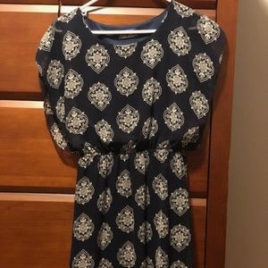 Navy blue dress with sheer patterned overlay